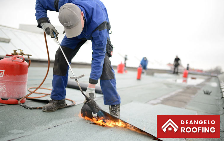 Professional doing welding on a roof